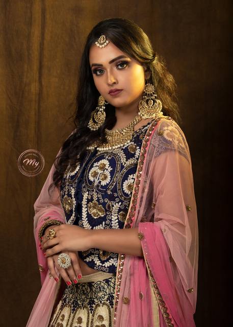 Studio bridal portrait in navy and pink with pearl jewellery and soft smoky eyes