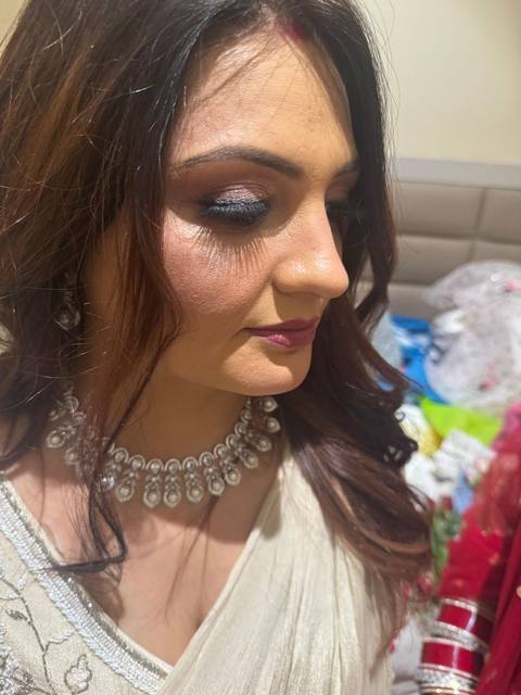 Manisha with a client in green saree