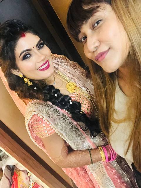 Manisha with a client with braided hair
