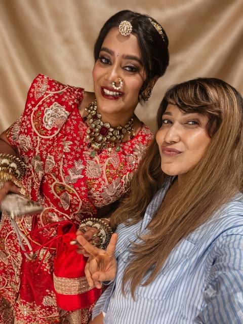 Manisha with a bride in red