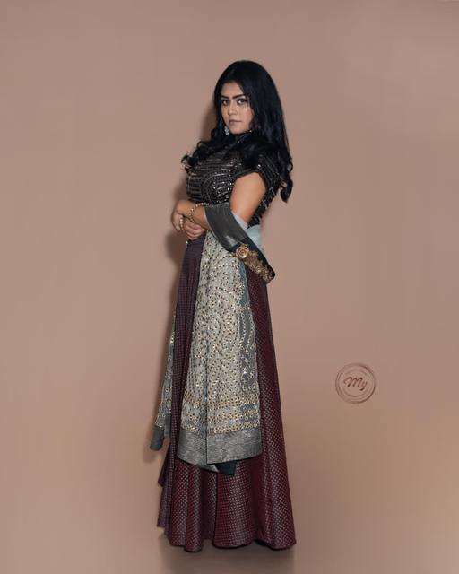 Studio fashion editorial in grey and maroon