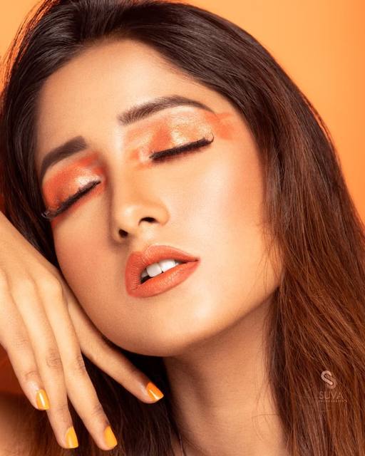 Glossy orange lids editorial beauty