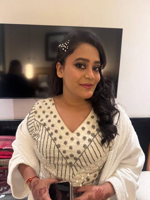 Smoky eyes with ivory outfit and side curls
